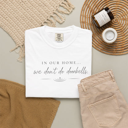 T-Shirt — "In Our Home We Don’t Do Doorbells" Minimalist Family Tee
